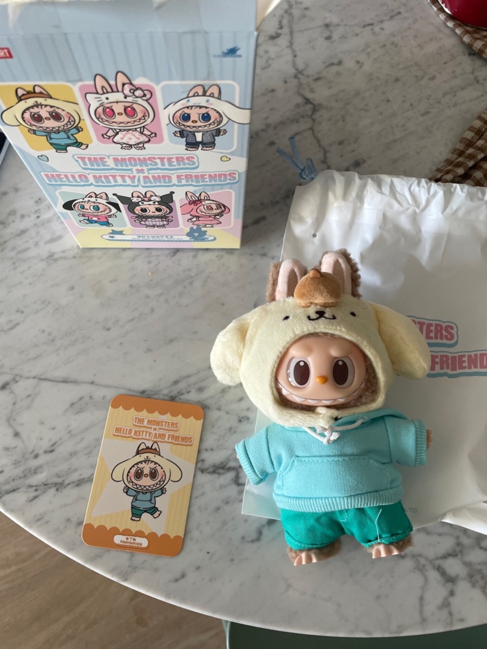 Hello Kitty and Friends x Labubu in Pompompurin